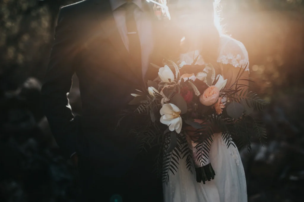 A silhouetted image of a husband and wife on their wedding day