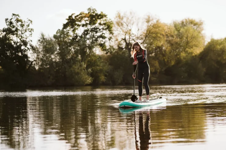 Woman paddleboarding on the river